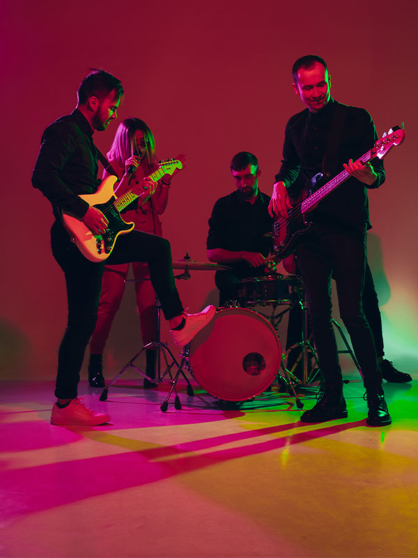 Young Caucasian Musicians Band Performing In Neon 1