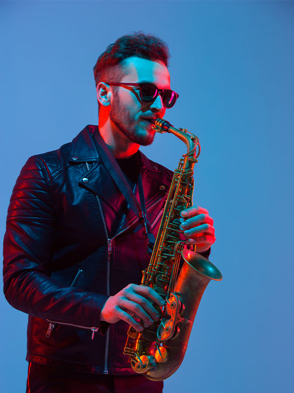 Young Caucasian Musicians Band Performing In Neon 3 1